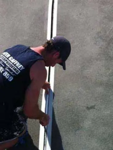 A Gaffneys tradesman working on a joint in a concrete deck